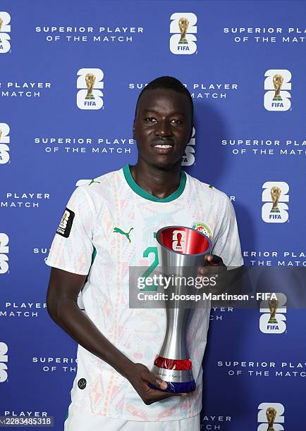 Pape Gueye of Senegal poses for a photograph with the Superior Player of the Match award after the FIFA World Cup 2026 Group I match between Senegal...