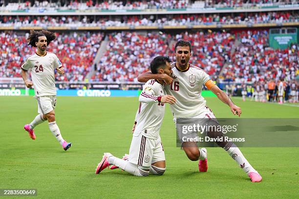 Alex Baena of Spain celebrates with teammate Rodri after scoring his team's first goal during the FIFA World Cup 2026 Group H match between Uruguay...