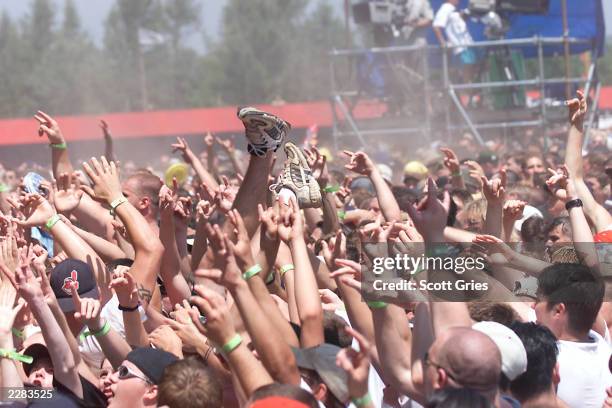 Fans at Woodstock 99 in Rome, New York. The Woodstock 99 festival will feature over 45 bands on four stages on July 23 and 25th. Crowd estimate for...