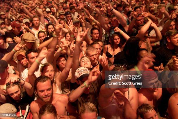Fans at Woodstock 99 in Rome, New York. The Woodstock 99 festival will feature over 45 bands on four stages on July 23 and 25th. Crowd estimate for...