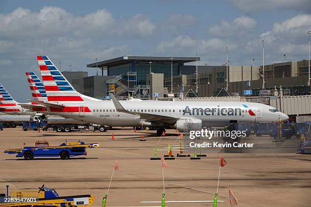 American Airlines airplanes are parked at Austin-Bergstrom International Airport on June 30, 2026 in Austin, Texas.