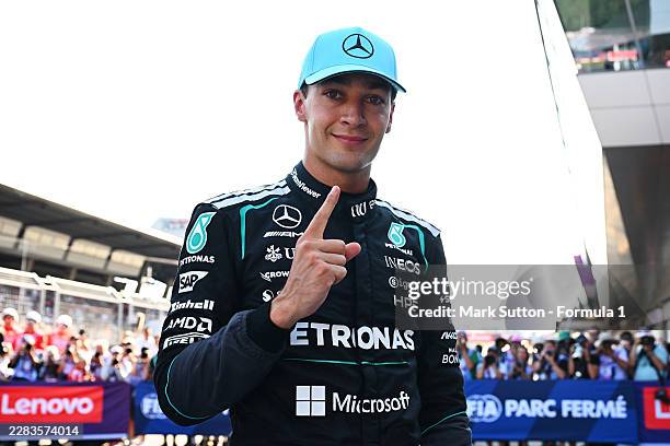 Pole position qualifier George Russell of Great Britain and Mercedes AMG Petronas F1 Team celebrates in parc ferme during qualifying ahead of the F1...