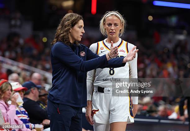 Sophie Cunningham of the Indiana Fever talks with Head Coach Stephanie White during the game against the Phoenix Mercury at Gainbridge Fieldhouse on...