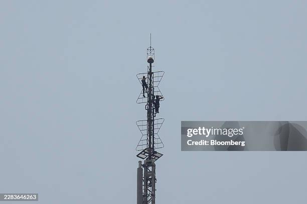 People climb up the spire of the Empire State Building in New York, US, on Wednesday, July 1, 2026. Two people got to the top of the Empire State...