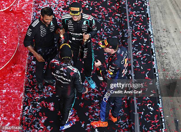 Race winner George Russell of Great Britain and Mercedes AMG Petronas F1 Team Second placed Max Verstappen of the Netherlands and Oracle Red Bull...
