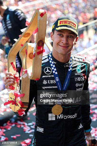 Race winner George Russell of Great Britain and Mercedes AMG Petronas F1 Team on the podium with his trophy during the F1 Grand Prix of Austria at...
