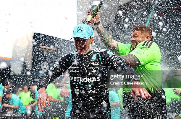 Race winner George Russell of Great Britain and Mercedes AMG Petronas F1 Team celebrates with his team during the F1 Grand Prix of Austria at Red...