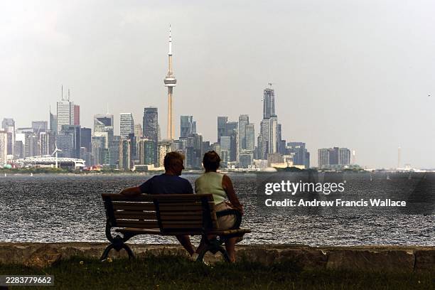 July 2 - A couple enjoy a Lake Ontario breeze at Prince of Wales Park in Toronto, July 2, 2026. Andrew Francis Wallace/Toronto Star