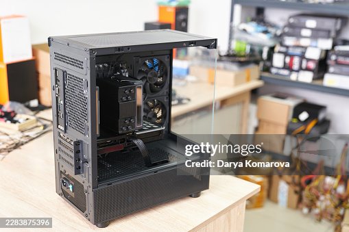 Custom-built gaming computer on a workbench in a computer workshop Custom-built gaming computer on a workbench in a computer workshop
