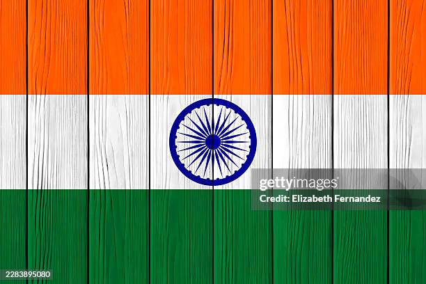 india flag with ashoka chakra painted on wooden planks background - ashoka chakra stock pictures, royalty-free photos & images