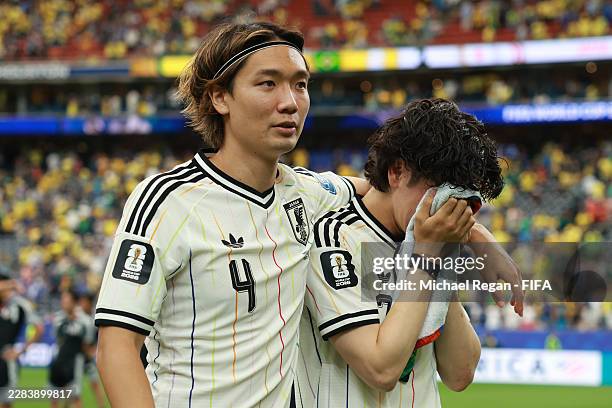 Kou Itakura and Ao Tanaka of Japan react after the 1-2 loss during the FIFA World Cup 2026 Round Of 32 match between Brazil and Japan at Houston...