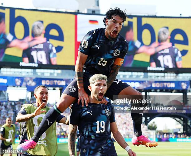 Julio Enciso of Paraguay celebrates with teammate Gustavo Gomez after scoring his team's first goal during the FIFA World Cup 2026 Round Of 32 match...