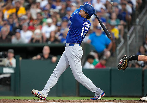 Shohei Ohtani of the Los Angeles Dodgers hits a three-run home run against the Athletics in the top of the six inning at Sutter Health Park on June...