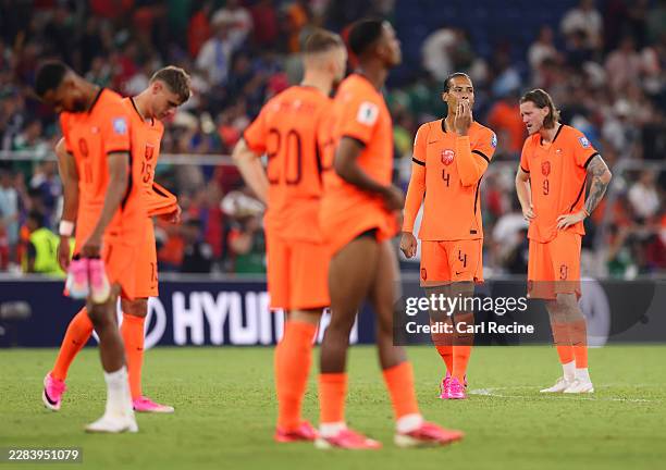 Virgil van Dijk and players of the Netherlands show dejection after the team defeat through the penalty shootout during the FIFA World Cup 2026 Round...