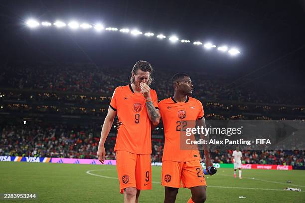 Wout Weghorst of the Netherlands is consoled by Denzel Dumfries of the Netherlands after the team' s defeat through the penalty shootout during the...