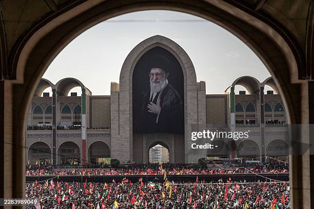 Mourners gather at the Grand Mosalla to pay their final respects to Iran's slain supreme leader Ayatollah Ali Khamenei at the start of his funeral...