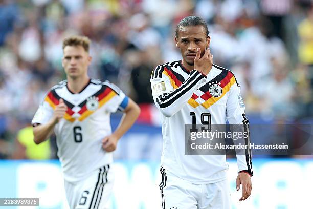 Leory Sane of Germany reacts with his team mate Joshua Kimmich during the FIFA World Cup 2026 Round Of 32 match between Germany and Paraguay at...
