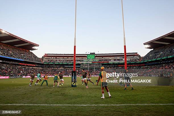 South Africa warms up ahead of the rugby Nations Championship match between South Africa and England at Ellis Park Stadium in Johannesburg on July 4,...