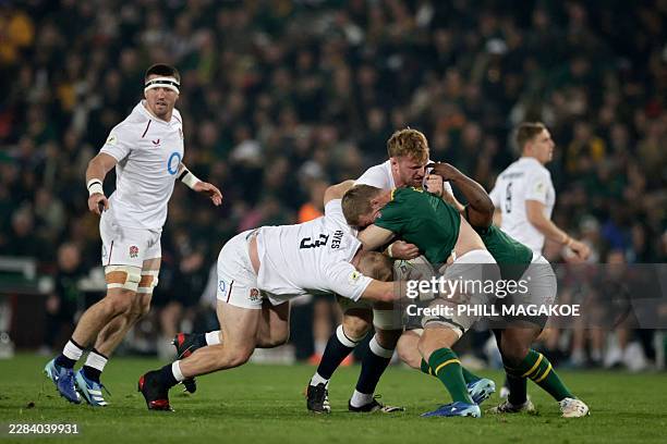 England's prop Joe Heyes tackles South Africa's flanker Eben Etzebeth during the rugby Nations Championship match between South Africa and England at...