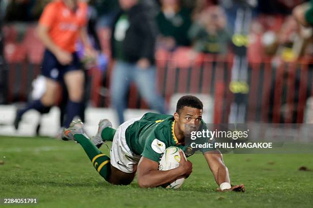 South Africa's scrum-half Grant Williams scores a try during the rugby Nations Championship match between South Africa and England at Ellis Park...