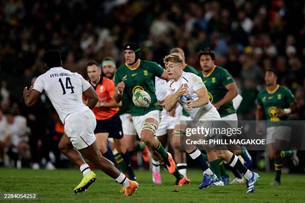 England's fly-half Fin Smith passes the ball during the rugby Nations Championship match between South Africa and England at Ellis Park Stadium in...
