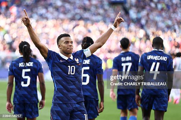 France's forward Kylian Mbappe celebrates scoring his team's first goal during the 2026 World Cup round of 16 football match between Paraguay and...