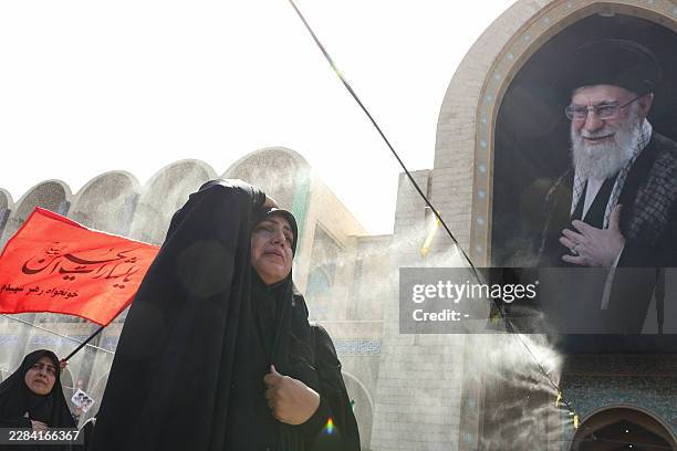 Mourners grieve as they gather to pray for Iran's slain supreme leader Ayatollah Ali Khamenei during the second day of funeral ceremonies at the...