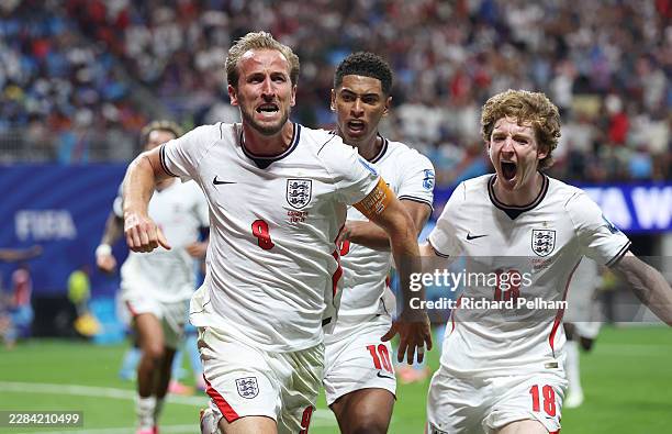 Harry Kane of England celebrates with teammates Jude Bellingham and Anthony Gordon after scoring his team's first goal during the FIFA World Cup 2026...