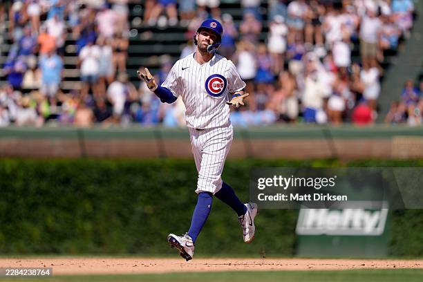 Dansby Swanson of the Chicago Cubs hits a grand slam home run in the eighth inning of a game against the San Diego Padres at Wrigley Field on July 1,...