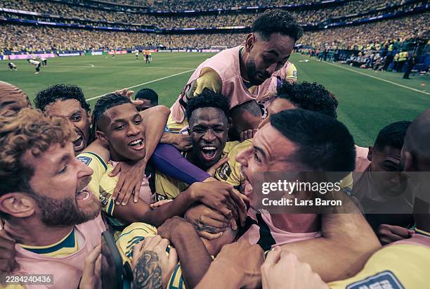 Gabriel Martinelli of Brazil celebrates with Vinicius Junior of Brazil and other team mates after scoring his teams second goal during the FIFA World...