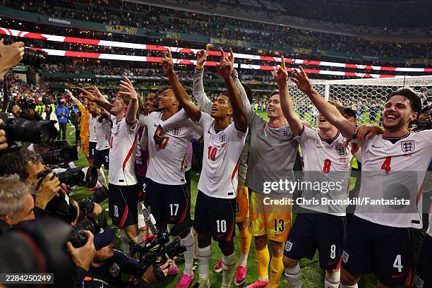 Jude Bellingham, Anthony Gordon & Declan Rice of England celebrate with team-mates at the end of the FIFA World Cup 2026 Round of 16 match between...