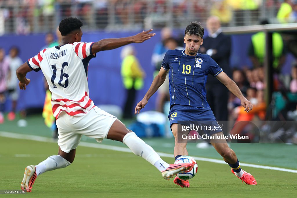 Rounded Graphics Kerim Alajbegovic of Bosnia and Herzegovina passes the ball under ...