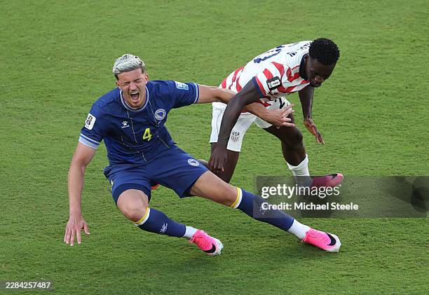 Folarin Balogun of the United States fouls Tarik Muharemovic of Bosnia and Herzegovina which is later reviewed by VAR and awarded as a red card foul...