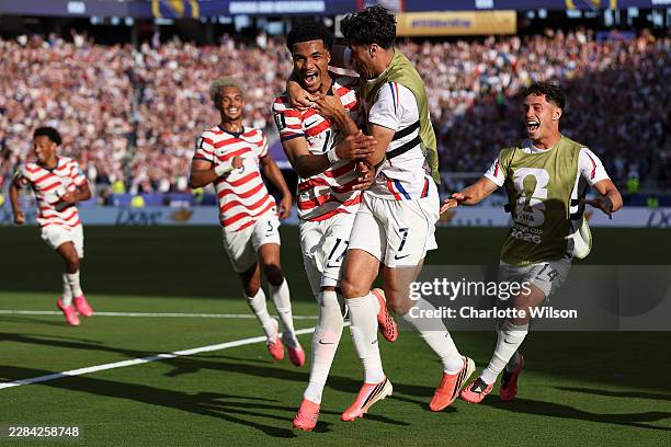 Malik Tillman of the United States celebrates with team mates after scoring his team's second goal during the FIFA World Cup 2026 Round of 32 match...