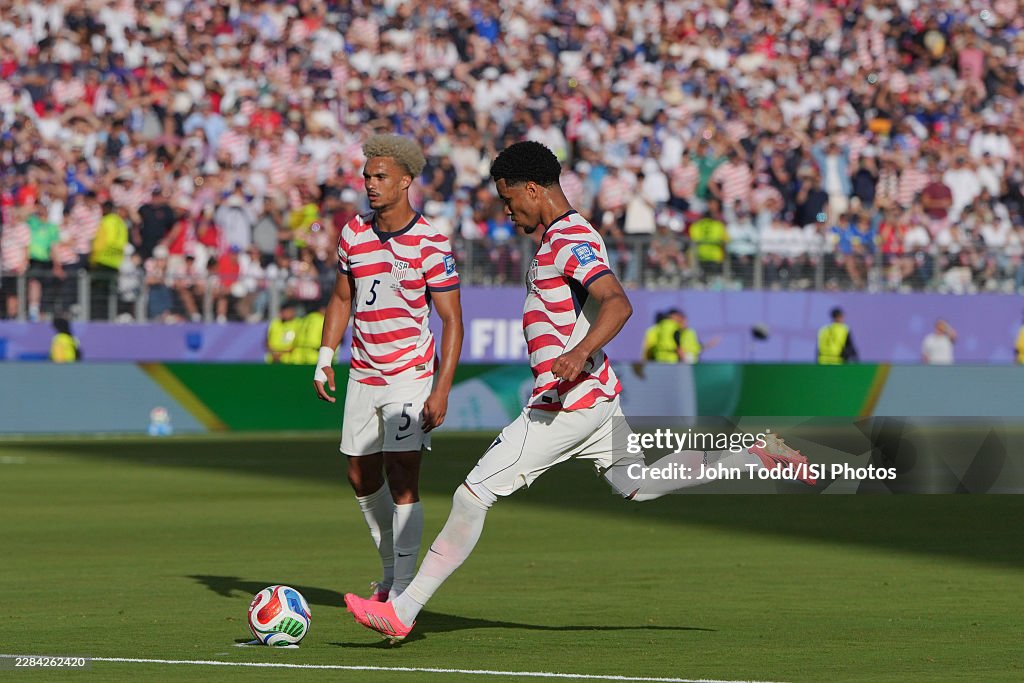 Rounded Graphics Malik Tillman of United States shoots and scores off a free kick ...
