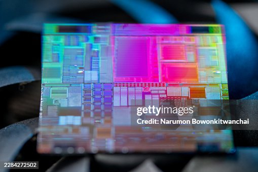 Advanced CPU microprocessor die on computer hardware cooling fan. Advanced CPU microprocessor die on computer hardware cooling fan.