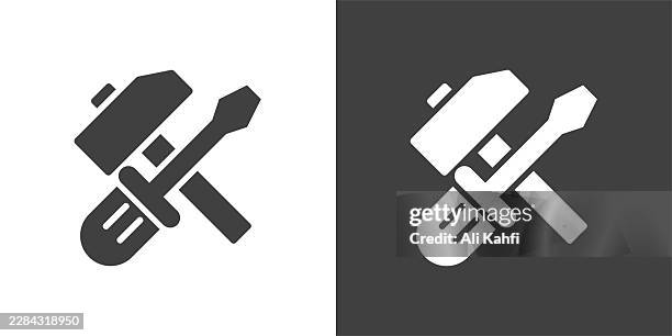 hammer and screwdriver glyph solid icon. solid icon that can be applied anywhere, simple, pixel perfect and modern style - safe digging stock illustrations