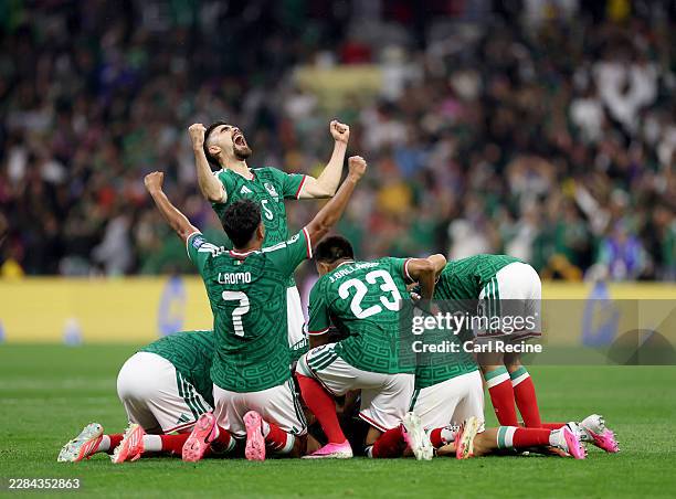 Raul Jimenez of Mexico celebrates scoring his team's second goal with Johan Vasquez and team mates during the FIFA World Cup 2026 Round Of 32 match...