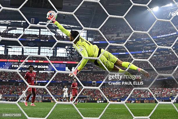 Portugal's goalkeeper Diogo Costa makes a save during the 2026 World Cup round of 16 football match between Portugal and Spain at the Dallas Stadium...