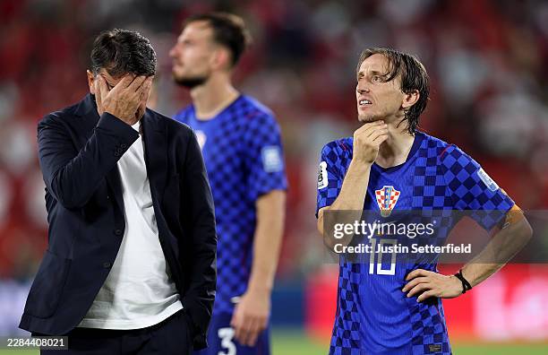 Zlatko Dalic, Head Coach of Croatia, and Luka Modric react after a 1-2 loss during the FIFA World Cup 2026 Round of 32 match between Portugal and...