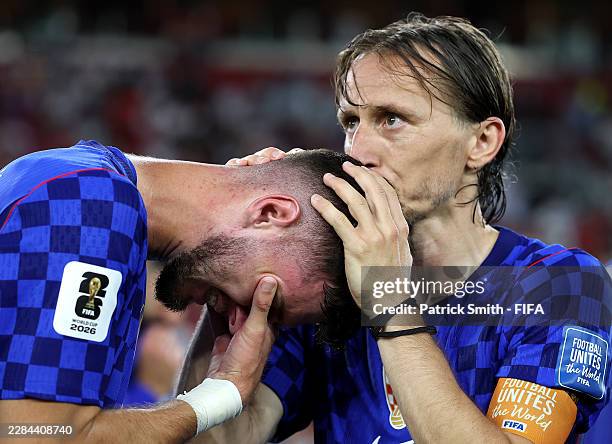 Mateo Kovacic and Luka Modric of Croatia react after the 1-2 loss during the FIFA World Cup 2026 Round of 32 match between Portugal and Croatia at...