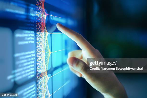 close-up of hand touching interactive data visualization screen. - folding screen stock pictures, royalty-free photos & images