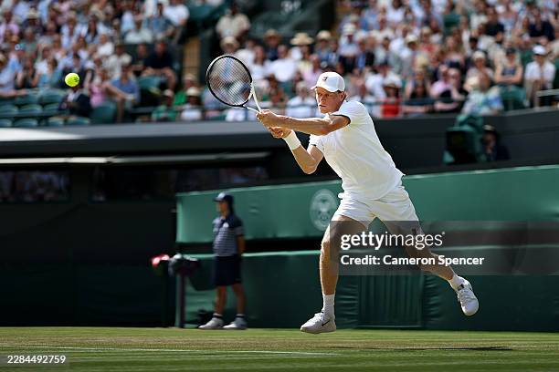 Jannik Sinner of Italy plays a backhand against Jenson Brooksby of United States during their Gentlemen's Singles third round match on day five of...