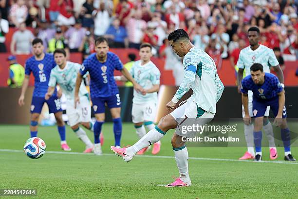 Cristiano Ronaldo of Portugal scores his team's first goal from the penalty spot during the FIFA World Cup 2026 Round Of 32 match between Portugal...
