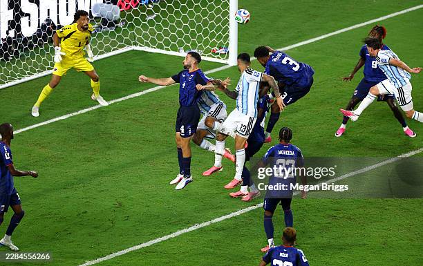 Cristian Romero of Argentina heads the ball that was deflected off Diney Borges of Cabo Verde for an own goal during the FIFA World Cup 2026 Round of...