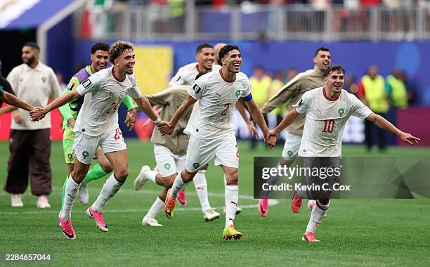 Neil El Aynaoui, Achraf Hakimi and Brahim Diaz of Morocco applaud fans after the 3-0 victory during the FIFA World Cup 2026 Round of 16 match between...