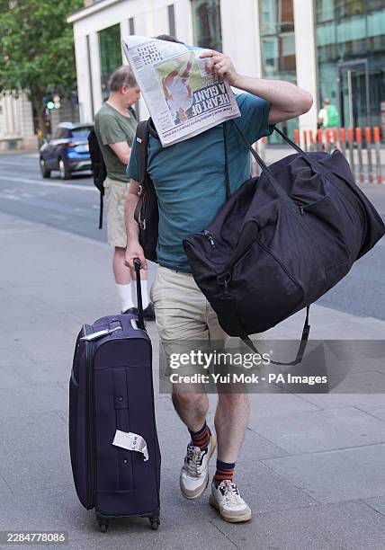 Count Binface, real name Jonathan David Harvey, covers his face with a paper as he arrives for his campaign launch at the Museum of Comedy in London....