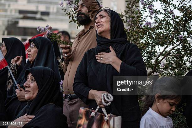 Mourners attend the funeral of Iran's slain supreme leader Ali Khamenei and members of his family, before he is buried at the Shrine of Imam Reza, in...