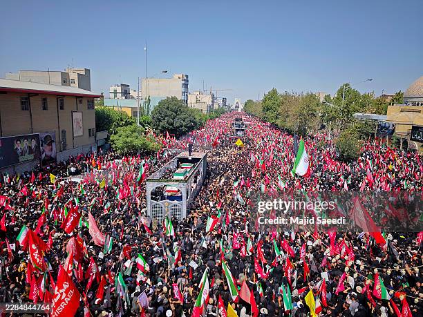 Mourners gather to pay final respects to Iran's slain Supreme Leader Ayatollah Ali Khamenei during the third day of his funeral ceremonies on July...