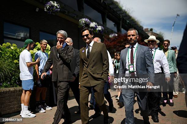 Former tennis player Roger Federer walks around the premises on day eight of The Championships Wimbledon 2026 at All England Lawn Tennis and Croquet...